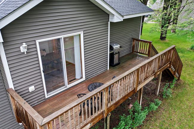 The deck walks out to the spacious backyard. | Image 10