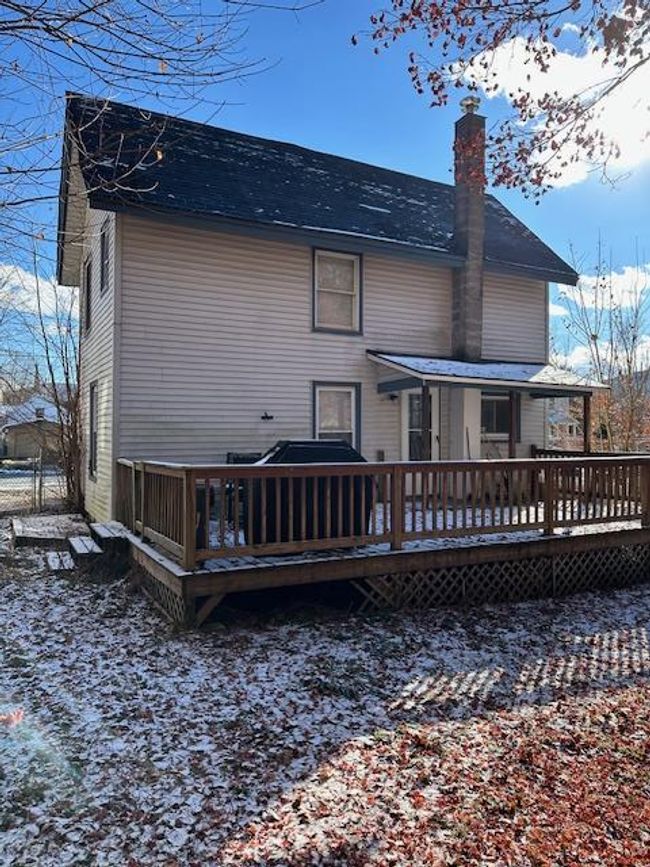 Snow covered house with a deck | Image 22