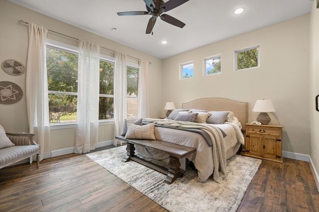This primary suite is tucked away on it's own wing and has plenty of space with a view of the beautiful backyard. | Image 16