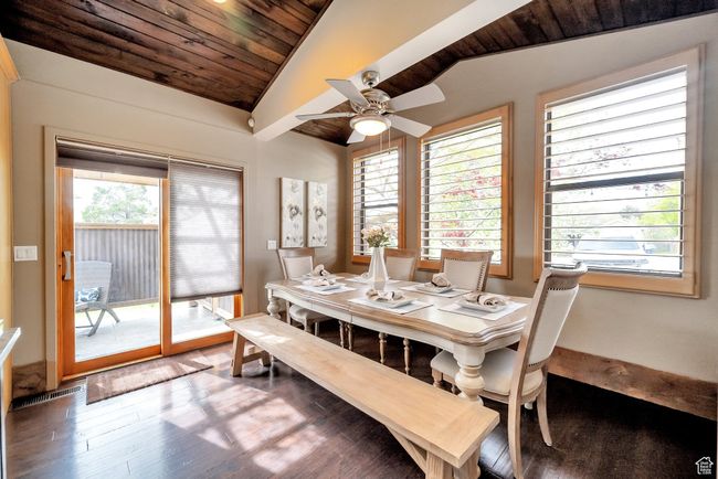 Dining room featuring wood finished floors, a ceiling fan, lofted ceiling, and wood ceiling | Image 11