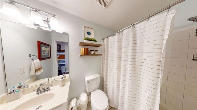 Private bath with tiled shower/tub | Image 13