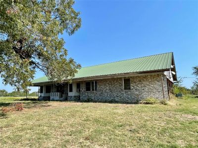 View of front of house featuring a front yard and covered porch | Image 1