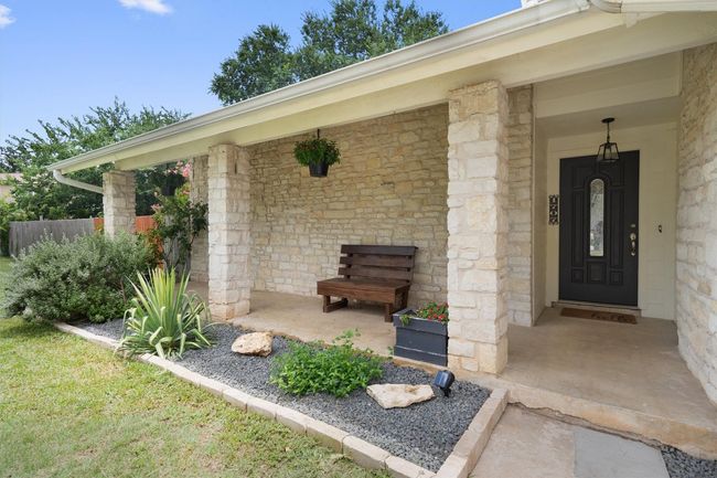 Entrance to property featuring stone siding | Image 4