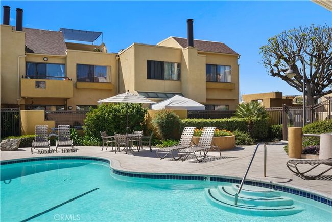 Pool on the left side of condo with waterfall | Image 20