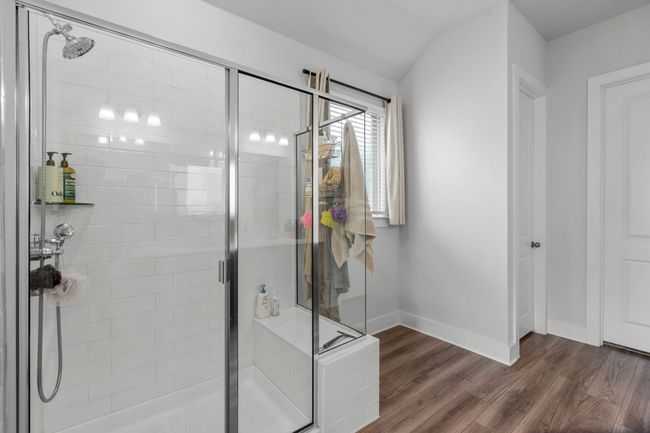 Bathroom with a stall shower and dark wood-style floors | Image 27