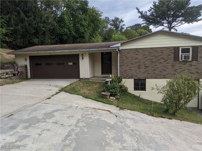 Ranch-style house featuring a garage | Image 2