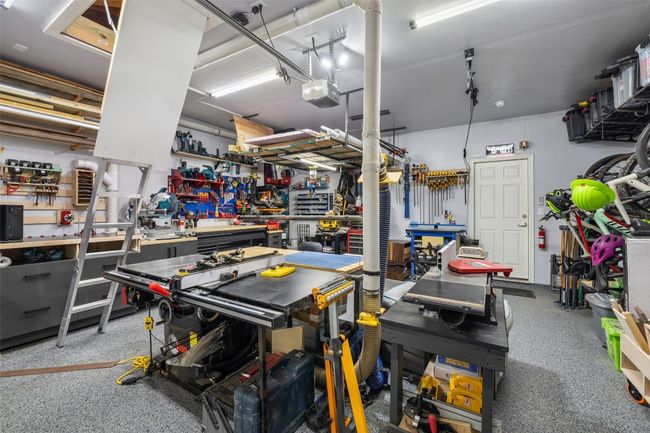 . Climate controlled 2 car garage plus storage above in attic with pull down stairs. | Image 14