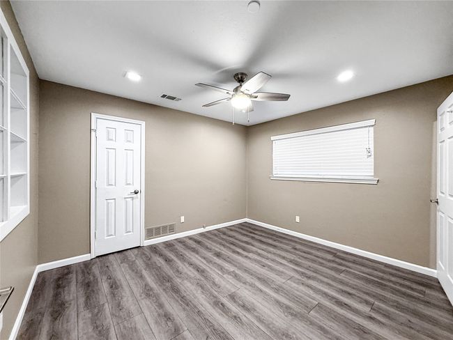 Unfurnished room featuring ceiling fan, wood finished floors, and recessed lighting | Image 35