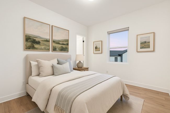 Bedroom featuring baseboards and light wood-style floors | Image 27