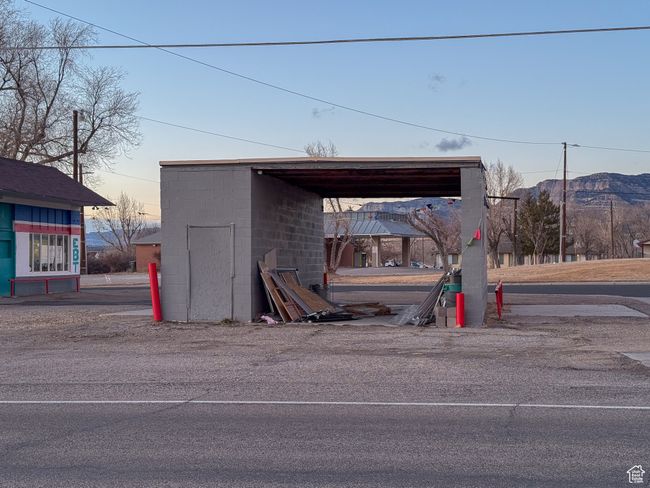 Outdoor structure at dusk with a mountain view and a carport | Image 6