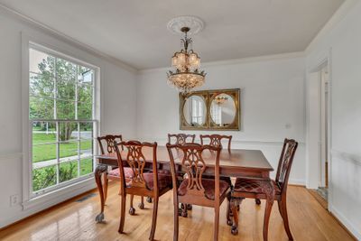 The Formal Dining room also boasts a floor to ceiling window. It is just separate enough to feel like it's own space and it connects directly to the kitchen for easy access at meal time. | Image 3