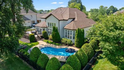 This is an incredible opportunity to purchase a home in Fairvue that already has a pool! The home features an open floorplan, a 4 car garage, and incredible views of the golf course as well as lake views of Old Hickory. | Image 1