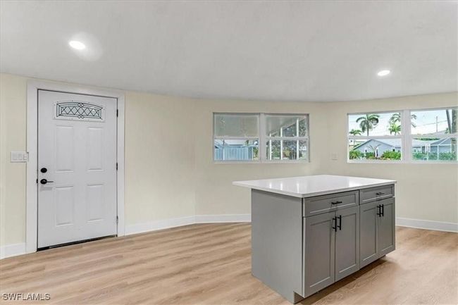 Kitchen looking to front door - Living area Unfurnished - Virtually edited | Image 17