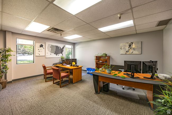 Home office with carpet floors, a paneled ceiling, and healthy amount of natural light | Image 14