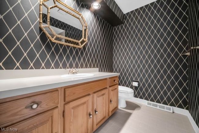 Bathroom featuring vanity, toilet, shower over tub | Image 36