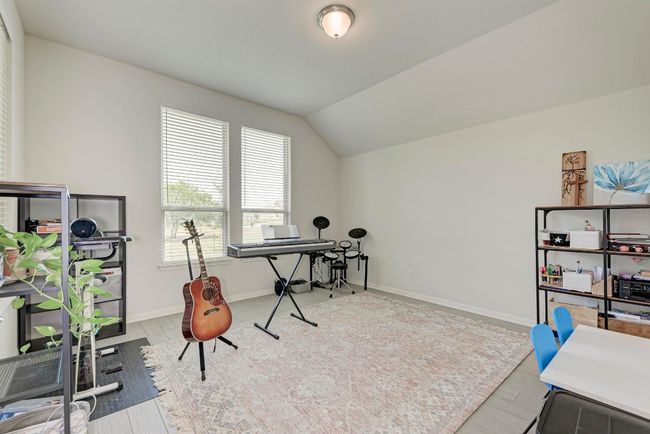 The second living space is accessed through French doors, overlooks the back yard and is adjacent to the Great Room. This flexible space has numerous potential uses - study/office, media room, hobby room, exercise room, music room, library... | Image 16