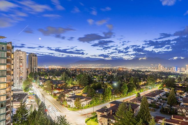 City view featuring a mountainous background | Image 28