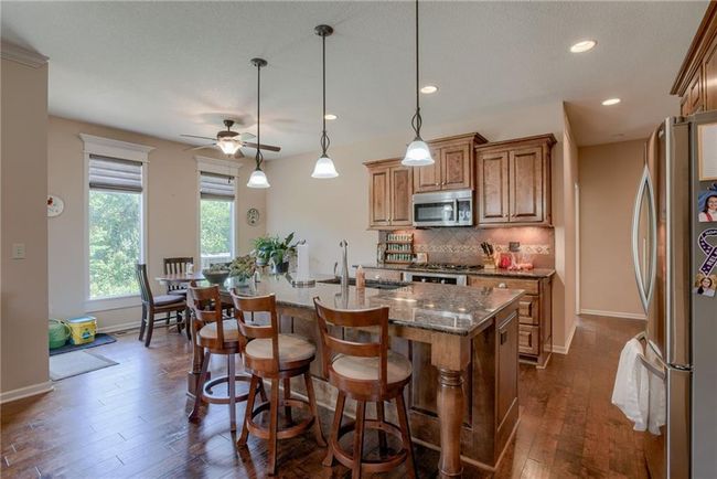 Lovely Kitchen with Gas Stove, Granite Countertops & Custom Cabinetry | Image 8