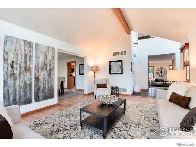 Lovely living room with soaring ceilings and hardwood floors | Image 7