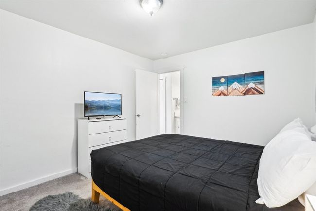 Carpeted bedroom featuring baseboards | Image 22