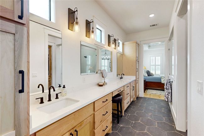 Ensuite bathroom featuring double vanity, recessed lighting, and tile patterned floors | Image 20