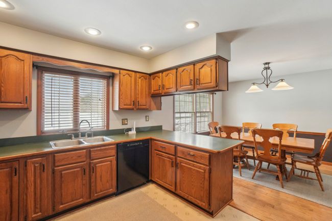 Kitchen overlooks rear yard. | Image 13