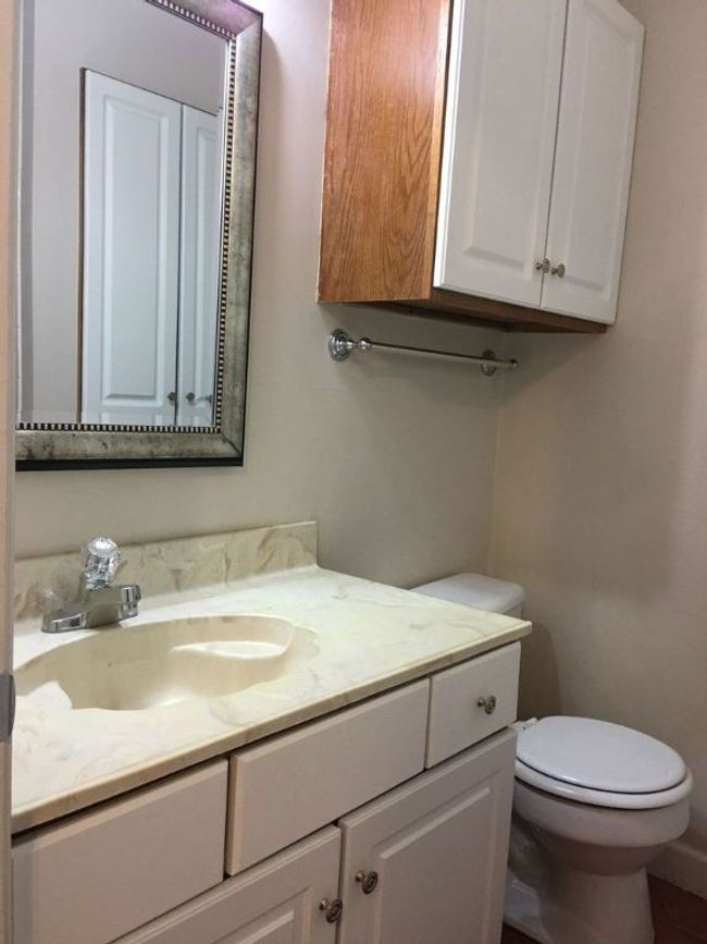 Bathroom with toilet and vanity | Image 7