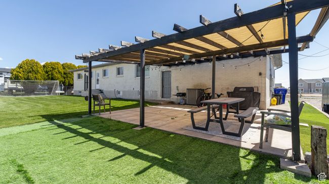 View of patio with a pergola and central air condition unit | Image 26