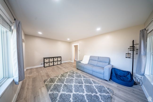 Sitting room with wood finished floors and recessed lighting | Image 10