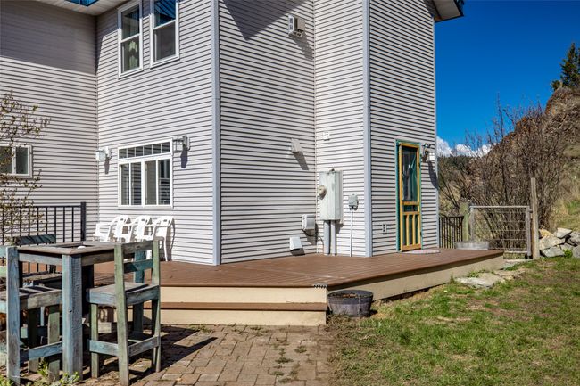 Back of property featuring a wooden deck and a yard | Image 82