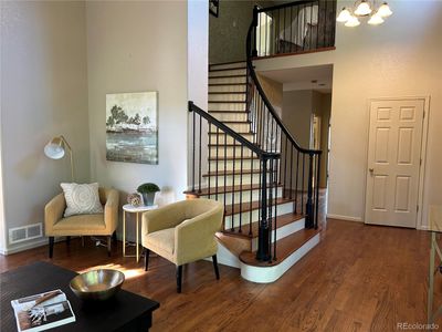 Front living room with stairway | Image 3