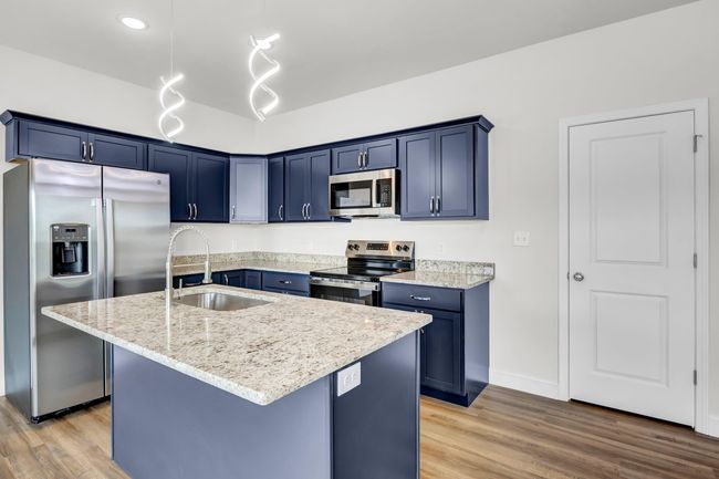 Features granite countertops and stainless appliances. | Image 10