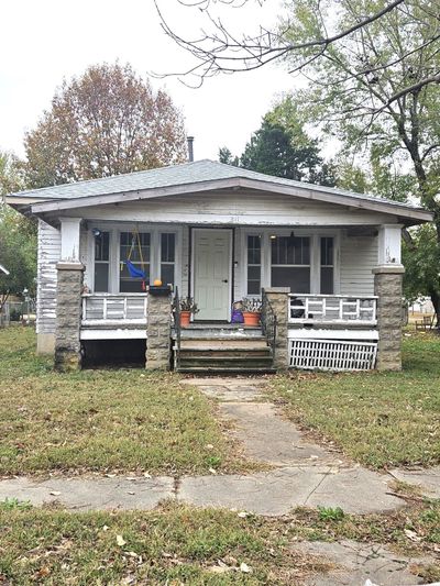 View of front of house featuring a porch and a front yard | Image 1