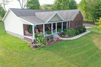 View of front of home featuring a front yard and a porch | Image 1