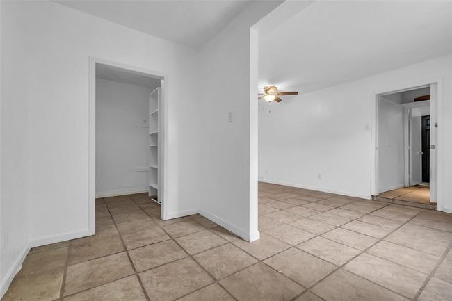 From the laundry room, you can see the pantry located right next to it, providing easy access for storage. | Image 14
