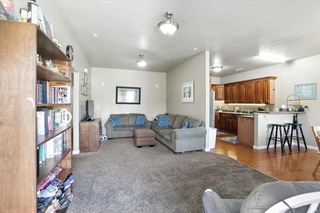 Living area with wood finished floors and baseboards | Image 6