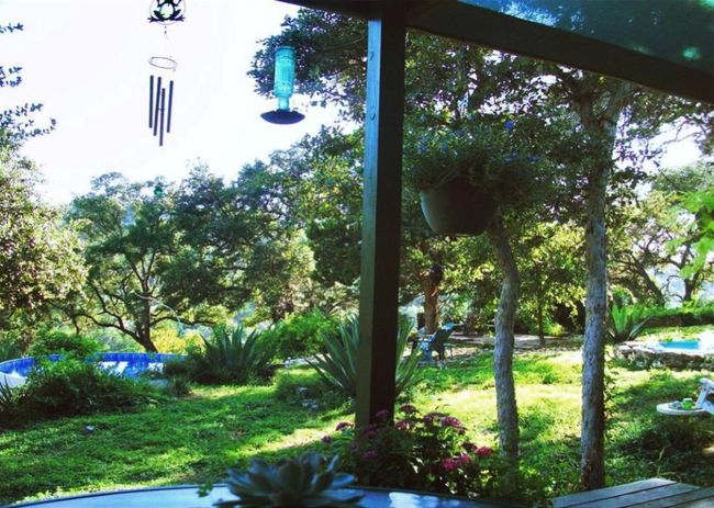 Cottage Property back patio with view of pool and water fountain | Image 34