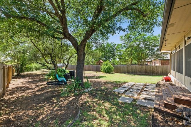 Tucked against Circle C Park, this expansive backyard feels like your own private nature preserve. | Image 22