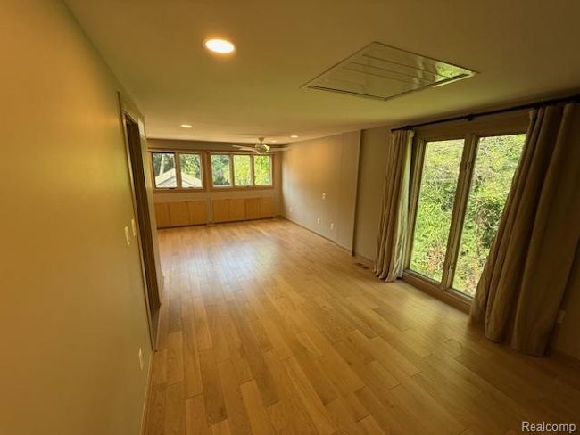 Unfurnished room with recessed lighting, light wood finished floors, and ceiling fan | Image 17