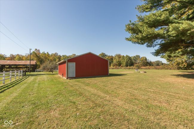 This workshop is equipped with utilities and plumbing, with a 1/2 bath present. | Image 6