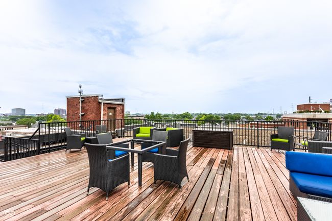 wooden deck with an outdoor living space | Image 35