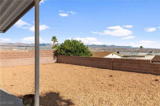 View of yard with a fenced backyard and a mountain view | Image 43