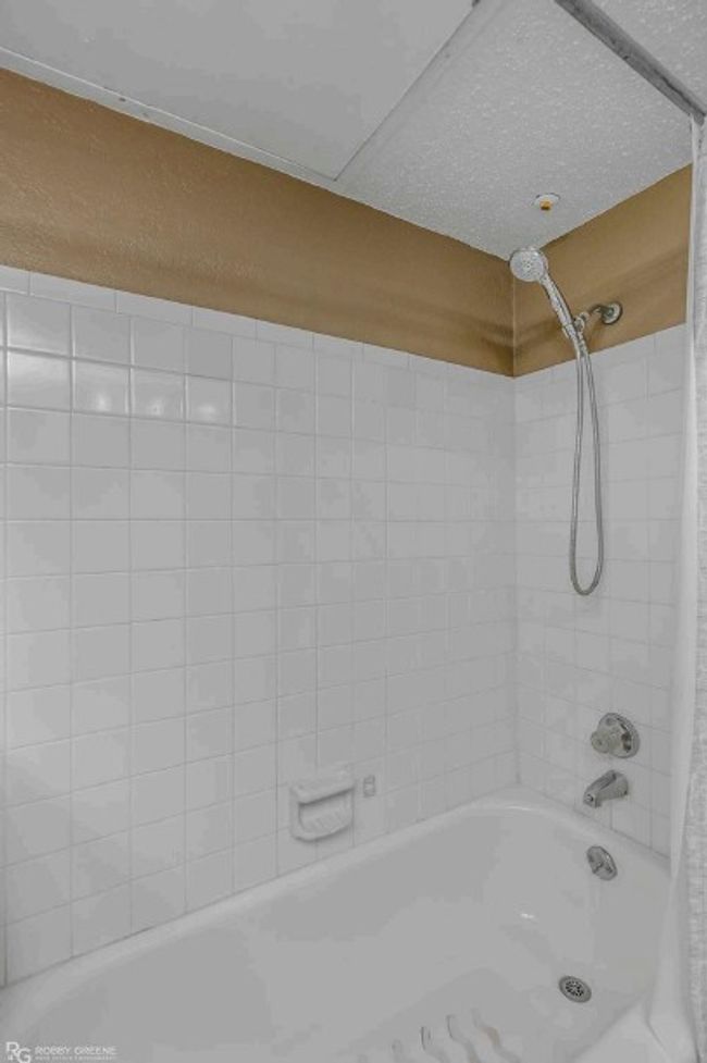 Full bath featuring shower / bath combination with curtain | Image 17