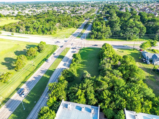 Aerial view of property and surrounding area featuring a tree filled landscape | Image 12