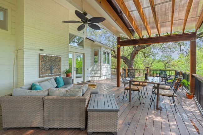 Deck featuring an outdoor living space, french doors, outdoor dining area, and ceiling fan | Image 32