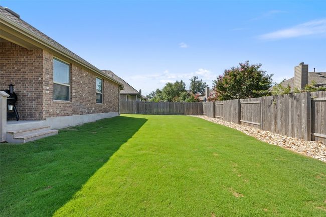 Enjoy a fully usable backyard with level lawn—ideal for family, pets, or a custom outdoor setup. | Image 32