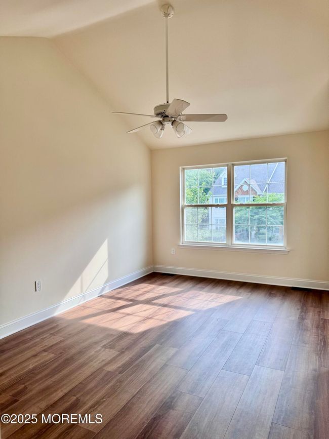 Another View of primary bedroom showing cathedral ceilings | Image 16