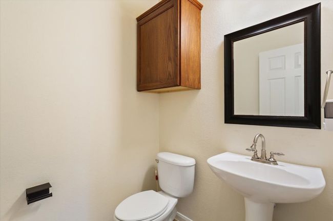 Half bath with toilet and a sink | Image 34