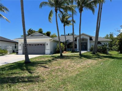 8896 Bracken Way, House other with 5 bedrooms, 3 bathrooms and null parking in Fort Myers FL | Image 2