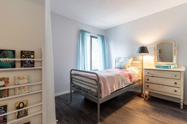 Bedroom featuring wood finished floors and baseboards | Image 17
